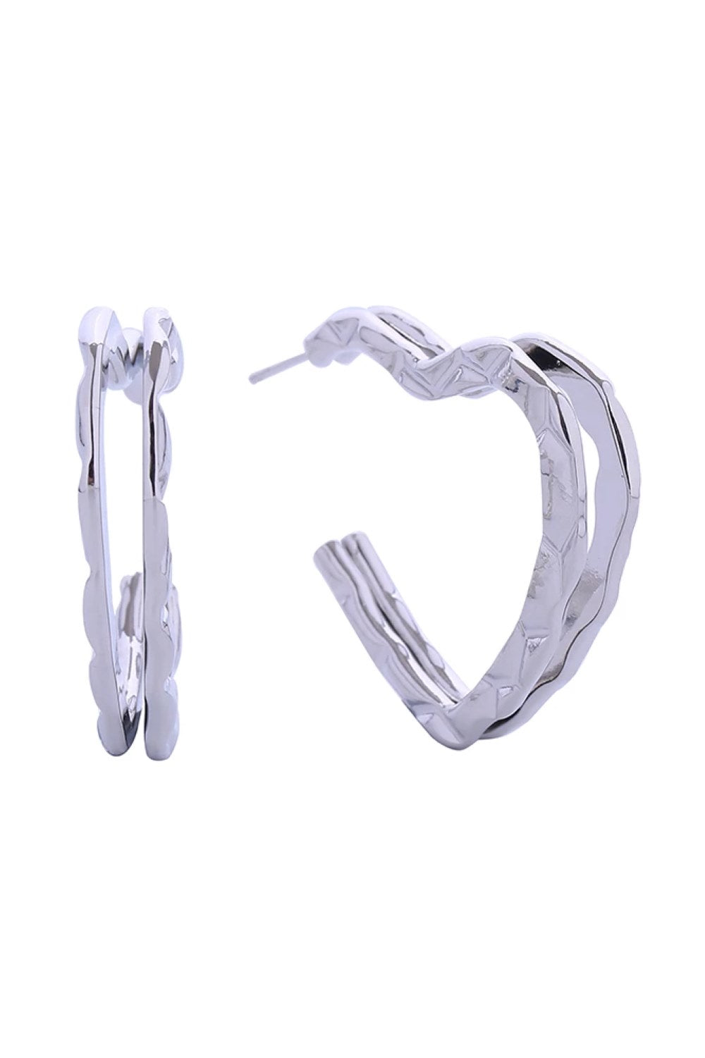 White Gold Delicate open heart post earrings crafted in brass with 14K gold and white gold dipping. These hypoallergenic studs measure 3.2cm and are lead and nickel compliant, making them safe for sensitive ears. Expertly made in Korea, they're the perfect everyday accessory that combines elegance with comfort.