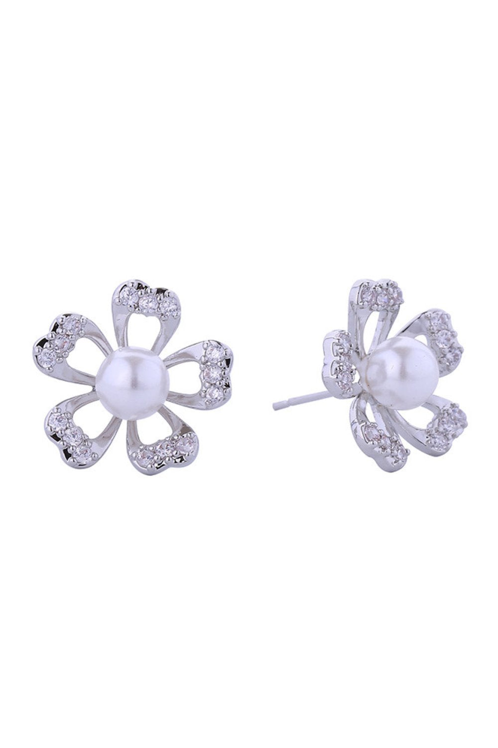 White Gold Timeless pearl post earrings with delicate gold and white dipped petal detailing. Each piece combines lustrous pearls with sparkling cubic zirconia accents, set in hypoallergenic brass for sensitive ears. At 1.7cm diameter, they strike the perfect balance between statement and subtlety. Lead and nickel compliant for peace of mind. Ideal for layering or wearing solo, these versatile studs transition seamlessly from day to evening.
