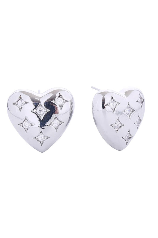 White Gold Elevate your everyday look with these charming 14K Gold/White Gold Dipped Puffy Heart Post Earrings. Crafted from quality brass and adorned with sparkling cubic zirconia, these delicate studs offer timeless elegance with a modern twist. At just 2cm, they're the perfect size for subtle sophistication. The hypoallergenic design ensures comfort for sensitive ears, while lead and nickel compliance guarantees safety and peace of mind.