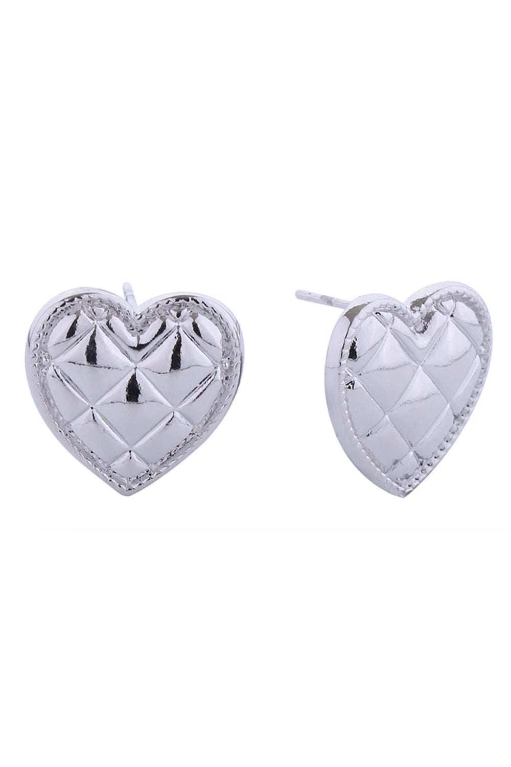 White Gold Delicate quilted heart studs crafted in brass with a hypoallergenic finish. Each earring measures 1.5cm in diameter, perfect for everyday elegance. Lead and nickel compliant for sensitive skin. A timeless addition to any jewelry collection.