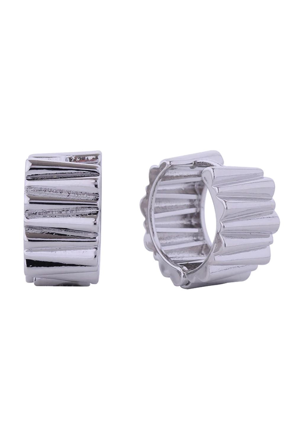 White Gold Elegant huggie hoops crafted in brass with 14K gold and white gold dipping. These hypoallergenic earrings feature a refined ridged texture and measure 1.8cm in diameter, perfect for a subtle yet sophisticated look. Lead and nickel compliant for sensitive skin.
