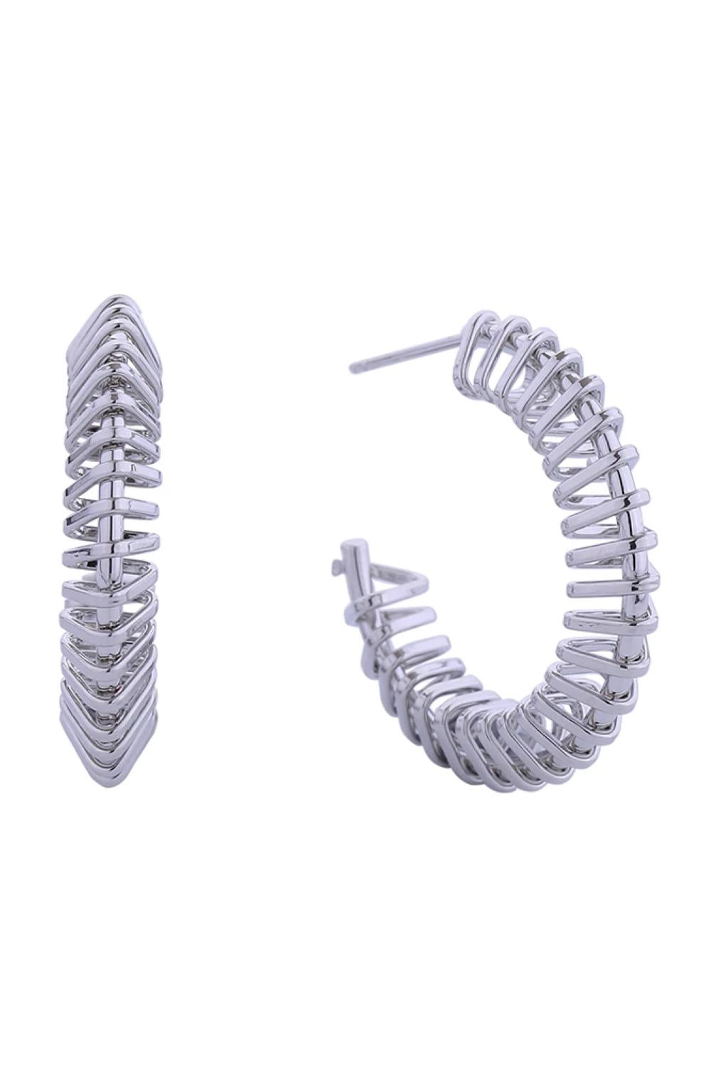 White Gold Elegant spiral C-hoop post earrings crafted in brass with a hypoallergenic finish. Each earring features a graceful curved design with a 3cm diameter, perfect for everyday wear or special occasions. Lead and nickel compliant, these earrings are safe for sensitive skin. The post closure ensures secure, comfortable wear throughout the day. A timeless addition to any jewelry collection.