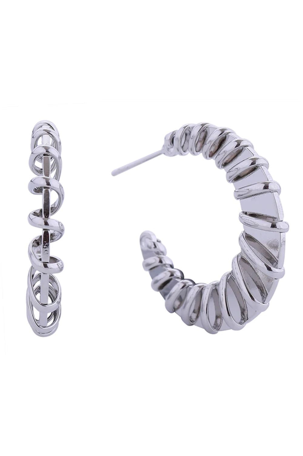 White Gold Elevate your everyday look with these stunning 14K Spiral Wave Post Earrings. Featuring an elegant spiral design with a graceful wave pattern, these earrings measure 3cm in diameter for a bold yet refined statement. Crafted from hypoallergenic brass, they're perfect for sensitive skin and designed to be worn comfortably all day long. Lead and nickel compliant, these earrings meet strict safety standards for peace of mind.