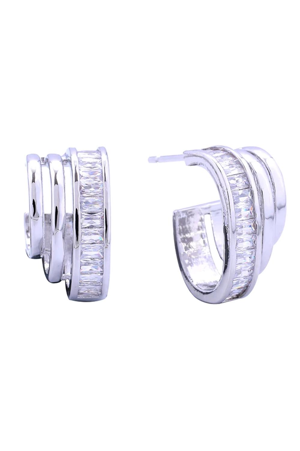 White Gold Elevate your everyday look with these stunning 14K Gold/White Dipped Trio Hoop Pave CZ Post Earrings. Crafted from quality brass and adorned with sparkling cubic zirconia pavé detailing, these versatile hoops offer timeless elegance with a modern twist. Measuring 1.8cm in diameter, they're the perfect size for comfortable all-day wear. The hypoallergenic post design makes them ideal for sensitive ears, while lead and nickel compliance ensures safety and peace of mind.