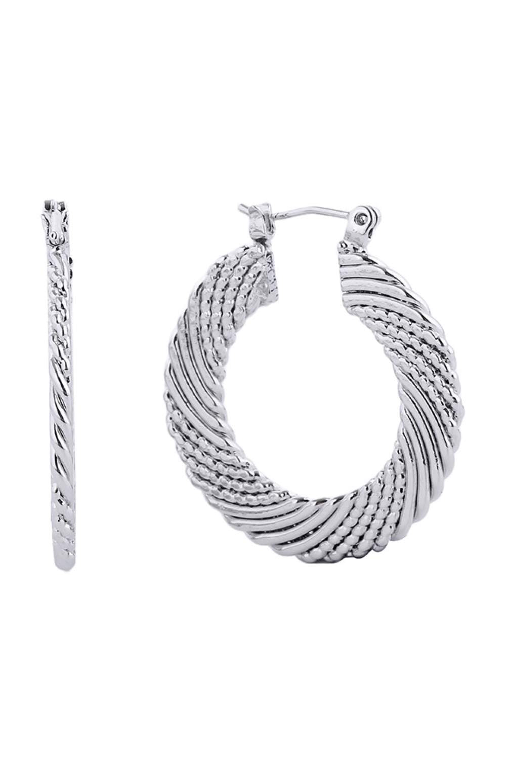 White Gold Elevate your everyday elegance with the Divine 14K Dipped Pin Catch Hoop. Crafted from hypoallergenic brass with a luxurious 14K gold or white gold dip, these timeless hoops offer both style and comfort. Measuring 2.59cm in diameter, they're the perfect size for versatile wear from casual days to special occasions. Lead and nickel compliant, these earrings are safe for sensitive skin. The secure pin catch closure ensures your hoops stay in place all day long.