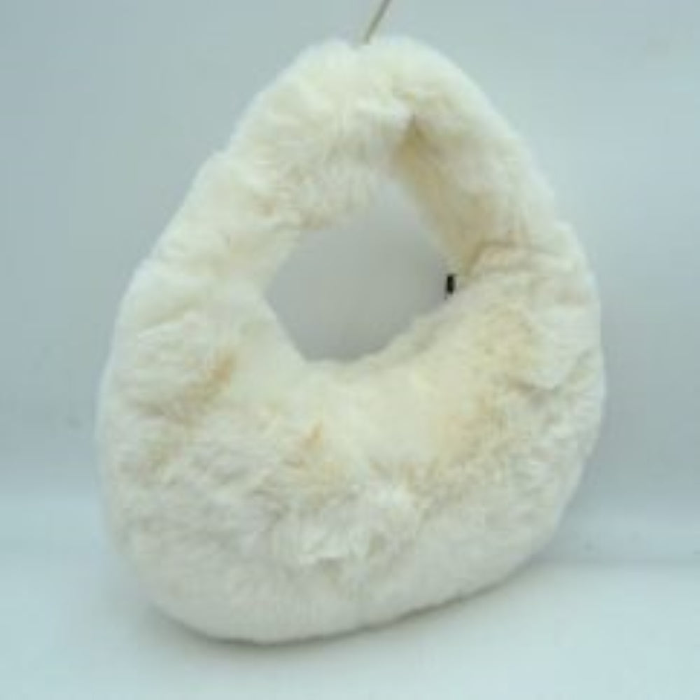 White This unique everyday handbag features an eye-catching, ultra-soft plush exterior that brings a cozy, tactile texture to your accessory collection. Designed with a curved crescent silhouette, it includes an integrated top cutout handle woven seamlessly into the form for easy hand or forearm carrying. The top opening provides access to a central main storage compartment, offering a playful yet functional solution for holding your daily essentials while adding a modern statement to any casual ensemble.

