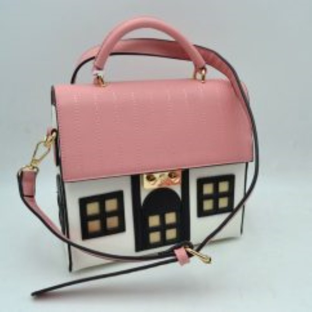 White Showcase your playful sense of style with this charming novelty house-shaped satchel bag, a whimsical conversational piece that adds an instant pop of personality to any look. Designed to mimic a classic cottage, this structural handbag features a contrast-stitched top flap resembling a tiled roof, paired with a detailed facade complete with cutout windows and a central doorway. The bag is securely fastened with a gleaming metallic latch that blends seamlessly into the design.