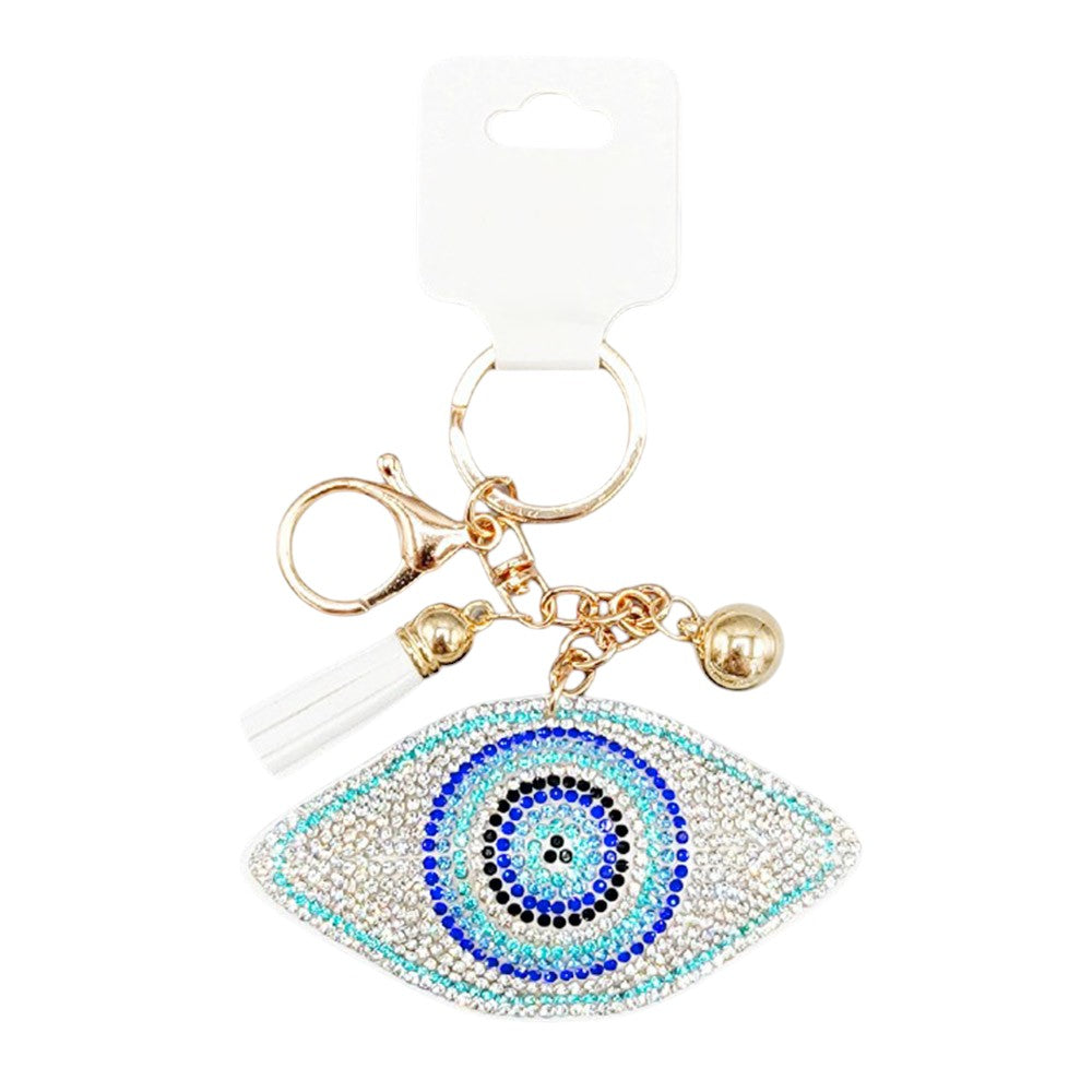 White Bling Evil Eye Tassel Bag Charm is a stylish accessory that adds a touch of glam to any bag. With its sparkling design and protective evil eye symbol, this charm is not only fashionable but also serves as a good luck charm. Perfect for adding a unique touch to your bag collection.
