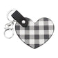 White Buffalo Check Patterned Faux Leather Heart Bag Charm features a trendy buffalo check pattern and a heart-shaped design, adding a touch of style to any handbag. Made from durable faux leather, this charm is both fashionable and functional. Perfect for those who love to accessorize with unique pieces!