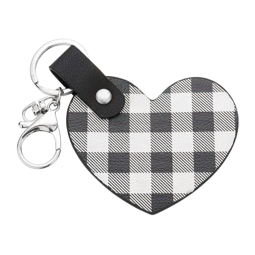 White Buffalo Check Patterned Faux Leather Heart Bag Charm features a trendy buffalo check pattern and a heart-shaped design, adding a touch of style to any handbag. Made from durable faux leather, this charm is both fashionable and functional. Perfect for those who love to accessorize with unique pieces!