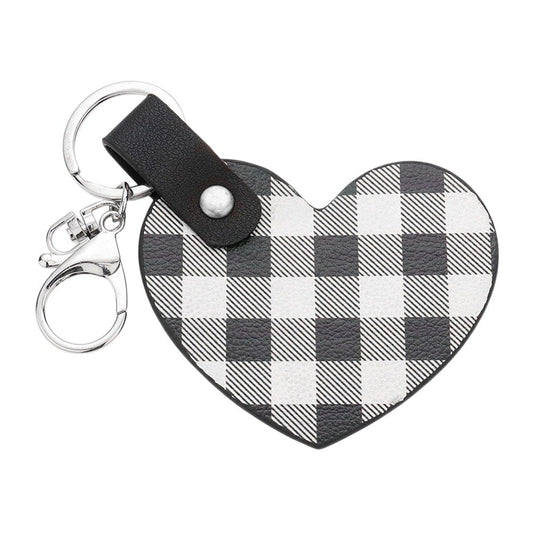 White Buffalo Check Patterned Faux Leather Heart Bag Charm features a trendy buffalo check pattern and a heart-shaped design, adding a touch of style to any handbag. Made from durable faux leather, this charm is both fashionable and functional. Perfect for those who love to accessorize with unique pieces!