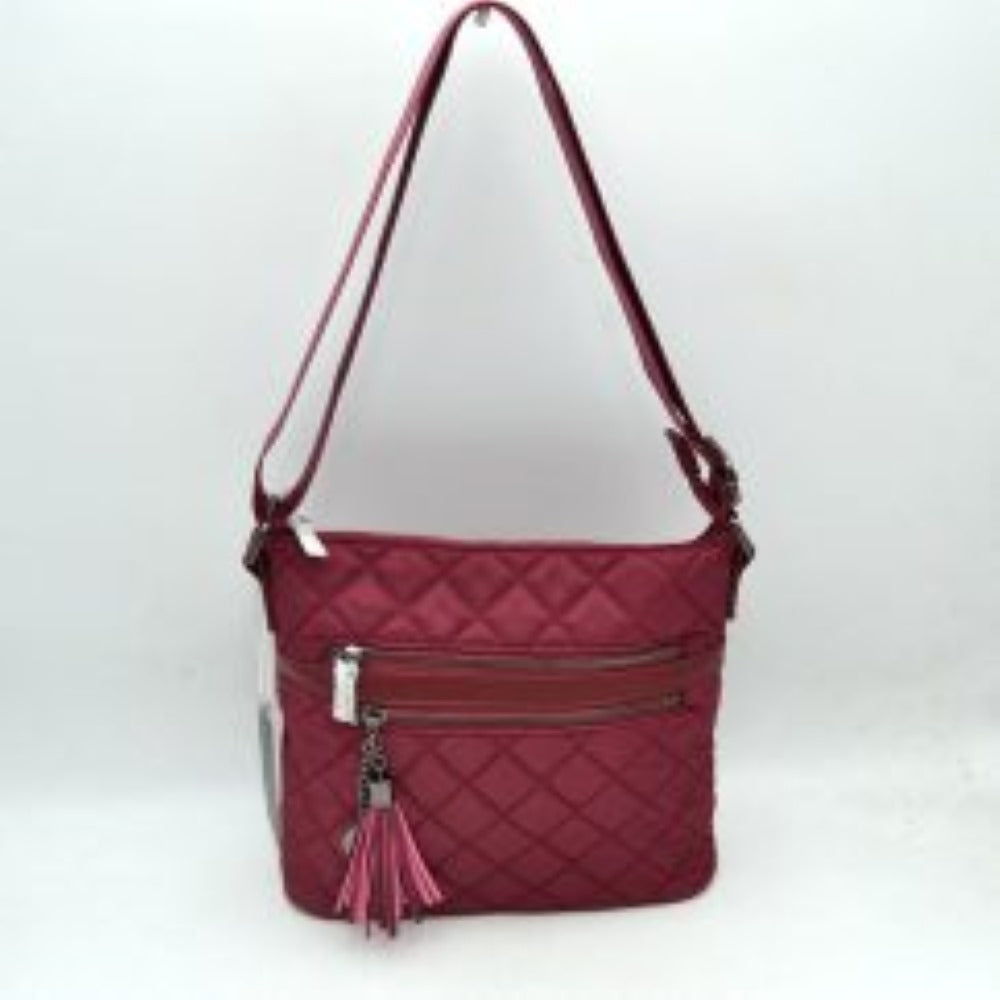 Wine This casual crossbody bag features a classic quilted texture and a slim, flexible design ideal for everyday use. It offers multiple functional storage compartments, including a top zipper closure for the main area and two parallel zippered front pockets for organized access to smaller items. A decorative tassel charm on a small chain accents the upper front zipper, while a wide, integrated adjustable shoulder strap allows for comfortable crossbody or over-the-shoulder wear.