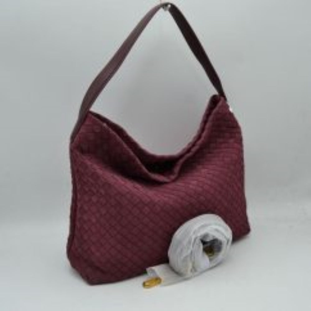 Wine This slouchy hobo bag showcases a textured woven pattern across its exterior, offering a refined look that is perfect for everyday use. The spacious main compartment provides ample storage for daily essentials, featuring a relaxed silhouette with a flat top shoulder strap for comfortable carrying. A separate, detachable secondary strap with metallic clasps is included, allowing for versatile styling options to suit your needs.