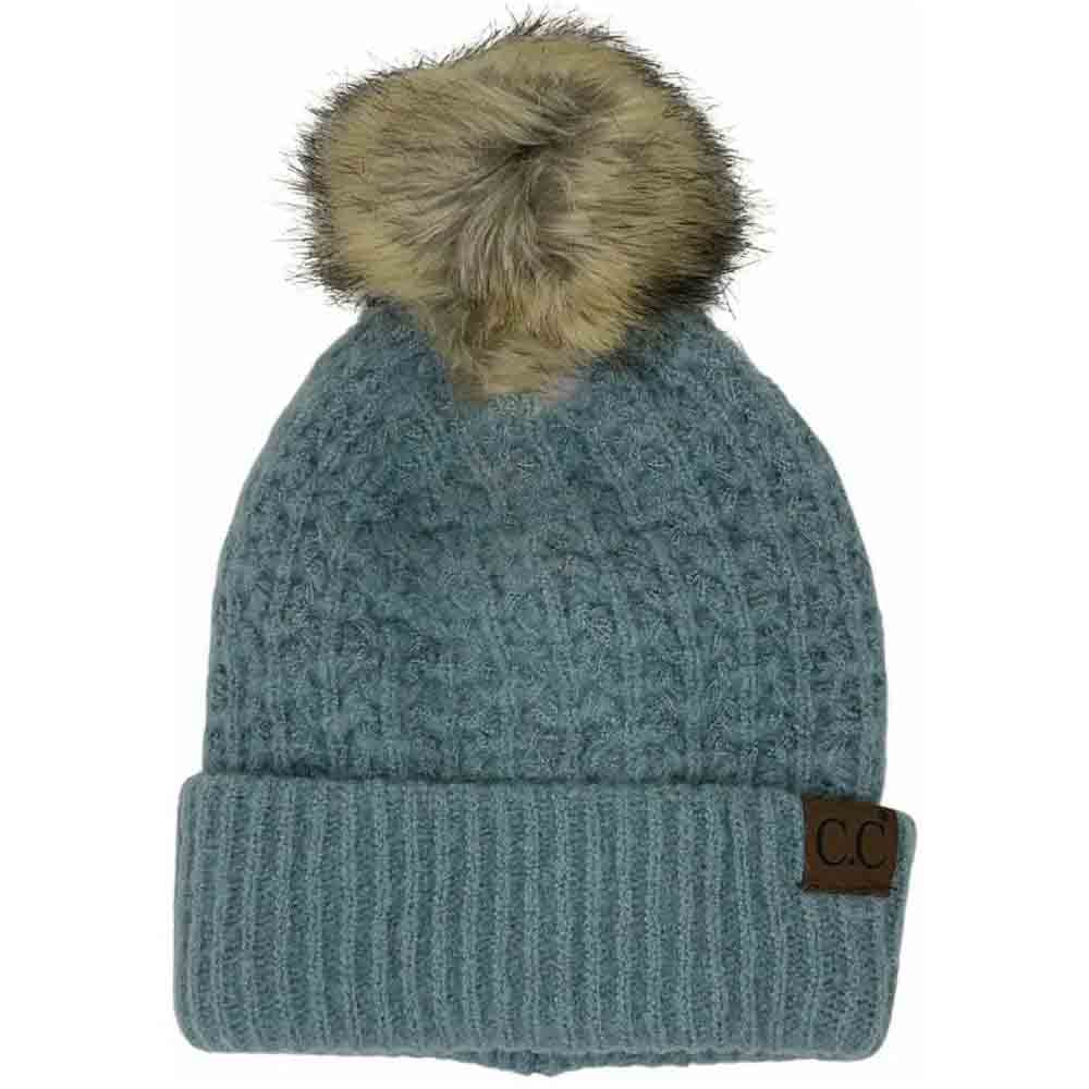 Winter Mint Solid Smocked Stitch Fur Pom C.C Beanie combines expert craftsmanship with functional winter style. Featuring a tightly smocked stitch pattern, this beanie ensures durability and a comfortable fit. The luxurious fur pom adds a refined accent, elevating this essential cold-weather accessory. Its design provides warmth without bulk, making it an excellent choice for outdoor activities or everyday wear during chilly seasons. 