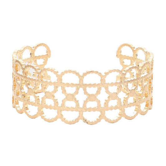 Worn Gold Textured Metal Open Oval Cuff Bracelet. This elegant piece features a unique textured design and an open oval shape, making it perfect for adding a touch of sophistication to any outfit. Crafted with quality metal, it is durable and comfortable to wear. Elevate your fashion game with this statement piece.