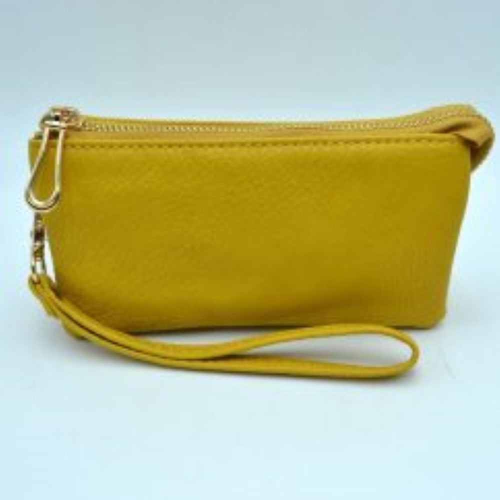 Yellow This sleek pouch features a textured, pebble-grained finish and a slim rectangular silhouette suitable for organized everyday use. It is designed with secure top zipper storage compartments to keep your daily essentials protected while on the go, accented by a distinct metallic teardrop-shaped zipper pull. A matching detachable wristlet strap with detailed zig-zag stitching connects securely via a metallic clasp, providing a convenient and stylish option for handheld carrying.