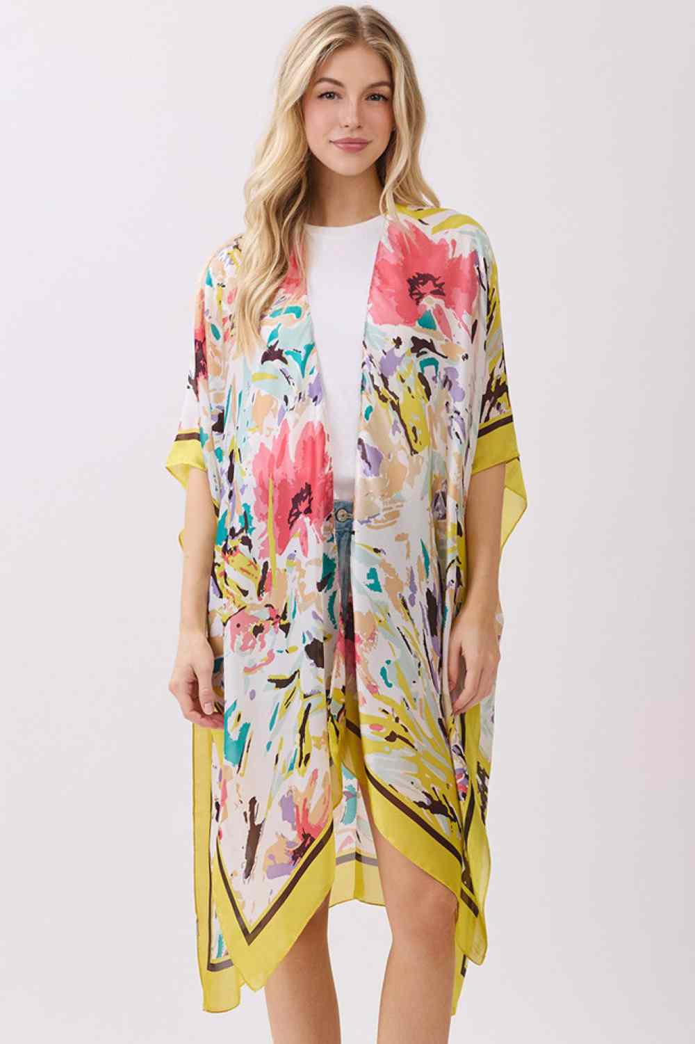 Yellow Effortless elegance meets comfort in this abstract floral kimono cover-up. Crafted from 100% polyester with a luxuriously silky feel, it features a vibrant floral print accented by solid color edges for a polished look. Perfect for layering over swimwear, loungewear, or casual outfits, this versatile piece transitions seamlessly from beach to brunch. Generous 35" x 36" dimensions provide flattering coverage and easy movement. An essential wardrobe staple for any season.