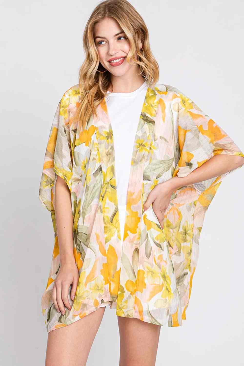 Yellow Effortless elegance meets comfort in this floral print cover up cardigan. Crafted from lightweight 100% polyester, it drapes beautifully over your favorite outfits for a polished, layered look. Perfect for beach days, casual outings, or adding dimension to any ensemble. Generously sized at 35" x 27.5" for a relaxed, flattering fit. An easy-to-wear essential that transitions seamlessly from season to season.