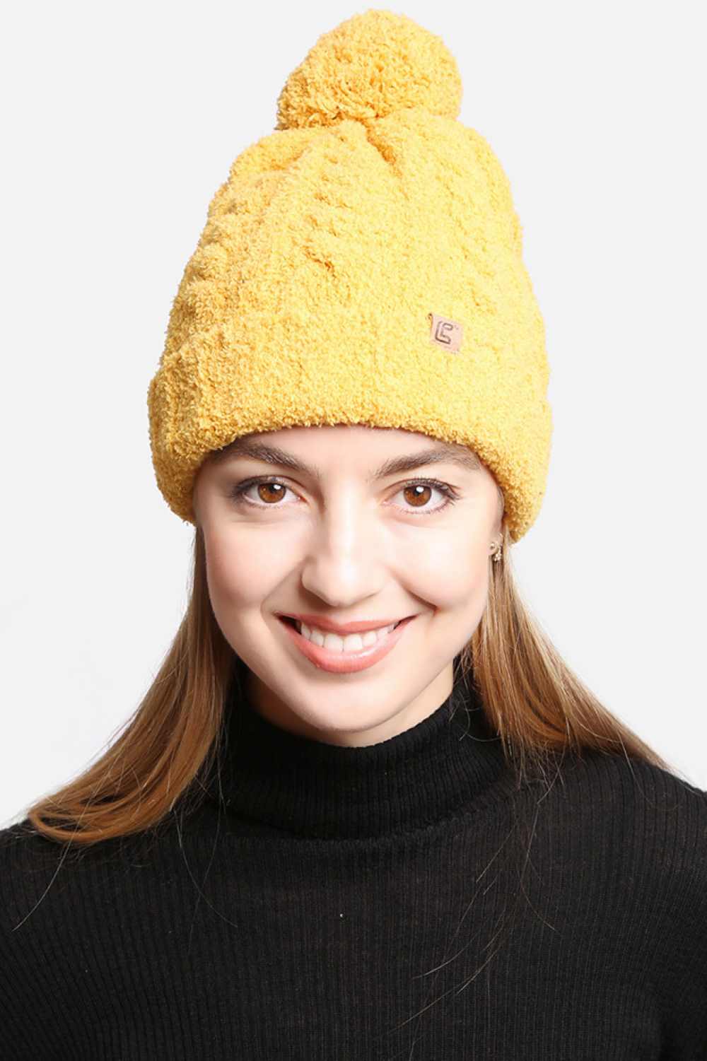 Yellow Solid Color Pom Beanie features a clean, classic knit design topped with a fluffy pom for a cozy, timeless winter look. Finished with a soft stretch fit, it delivers warm comfort while adding effortless charm to your cold-weather outfits.
