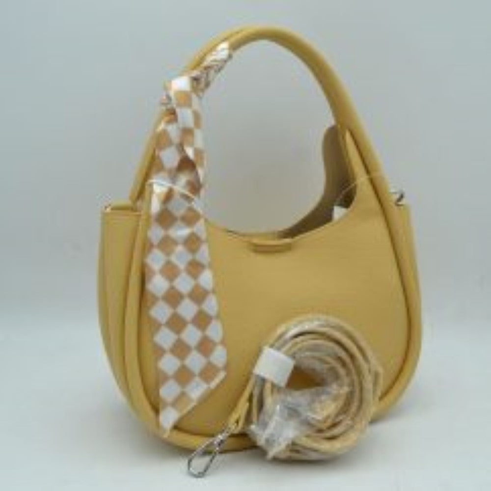 Yellow Embrace a sleek, modern aesthetic with this beautifully contoured hobo shoulder bag, designed to add an effortless touch of class to your collection. Featuring a classic crescent-shaped silhouette and a premium pebble-textured finish, this handbag provides excellent durability while maintaining its upscale, structured look. The sleek top shoulder strap is chicly wrapped with a removable checkerboard print accent scarf, offering a subtle nod to vintage elegance.