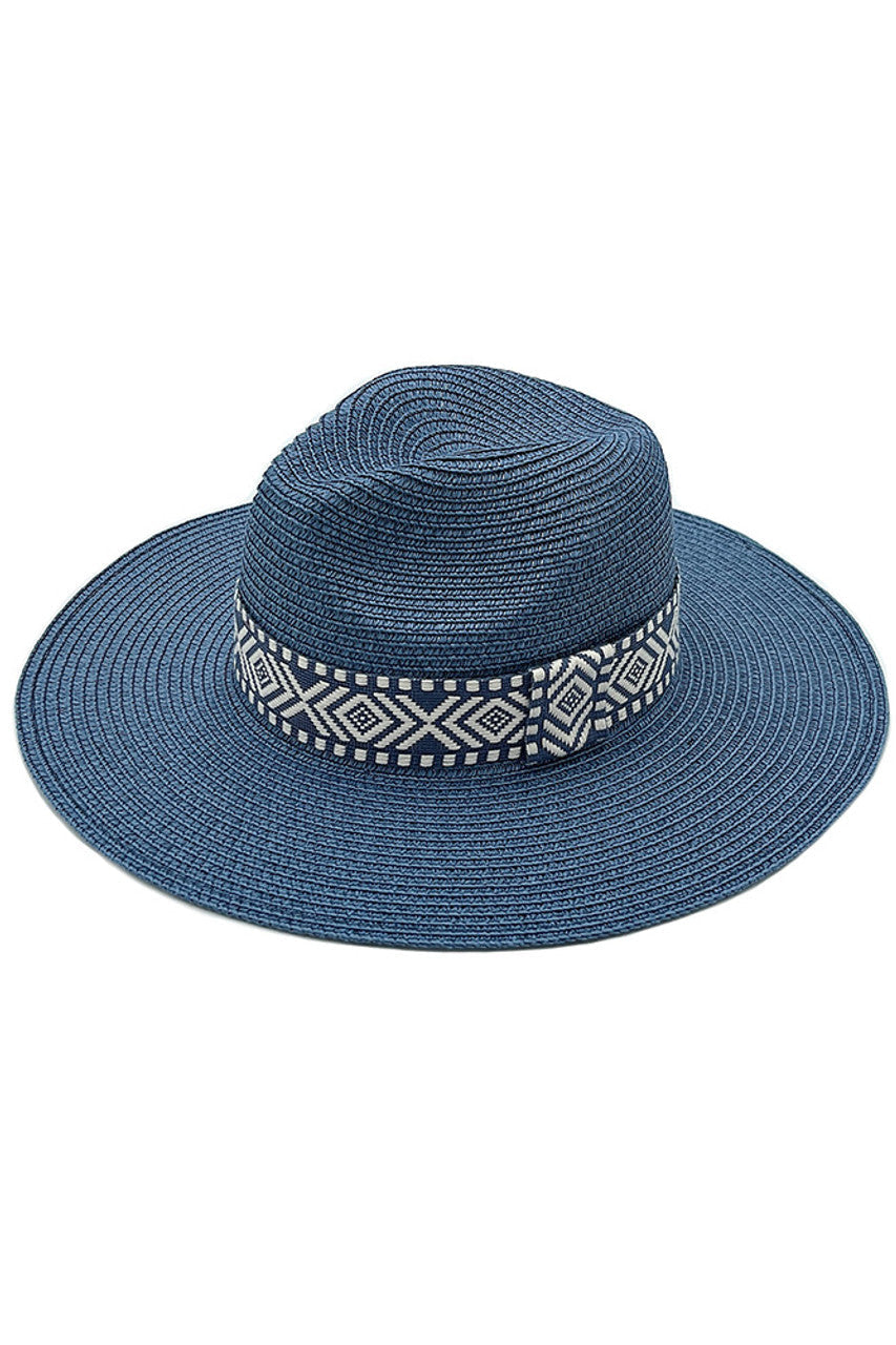 Navy AZTEC BAND PANAMA HAT features a distinctive Aztec band, combining traditional weaving techniques with cultural artistry. The tightly woven natural fibres create exceptional durability while maintaining breathability for temperature regulation. The precisely angled brim offers optimal sun protection without compromising style. Each hat exhibits subtle variations, reflecting its handcrafted nature and superior craftsmanship—an investment piece for the sophisticated wardrobe. 