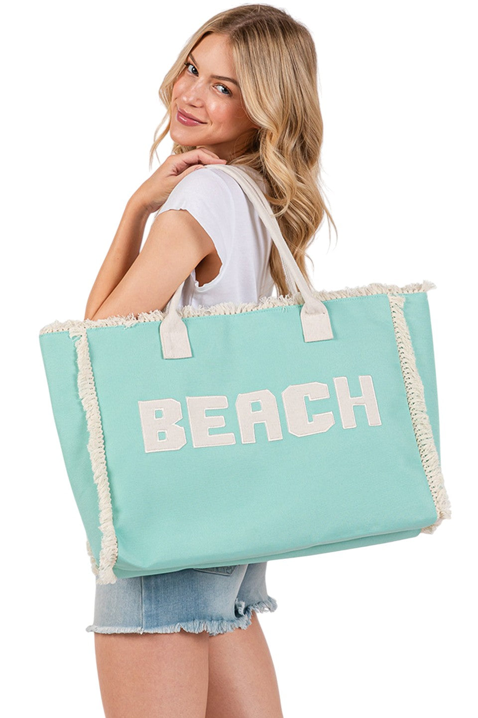 Mint BEACH Embroidered Letter Fringe Summer Tote Bag combines style and practicality for your warm-weather outings. Crafted with durable materials, it features detailed embroidered lettering and playful fringe accents that enhance its summery appeal. Spacious enough to carry essentials, this tote is perfect for beach days or casual errands, offering both functionality and a distinctive, expert-crafted design. 
