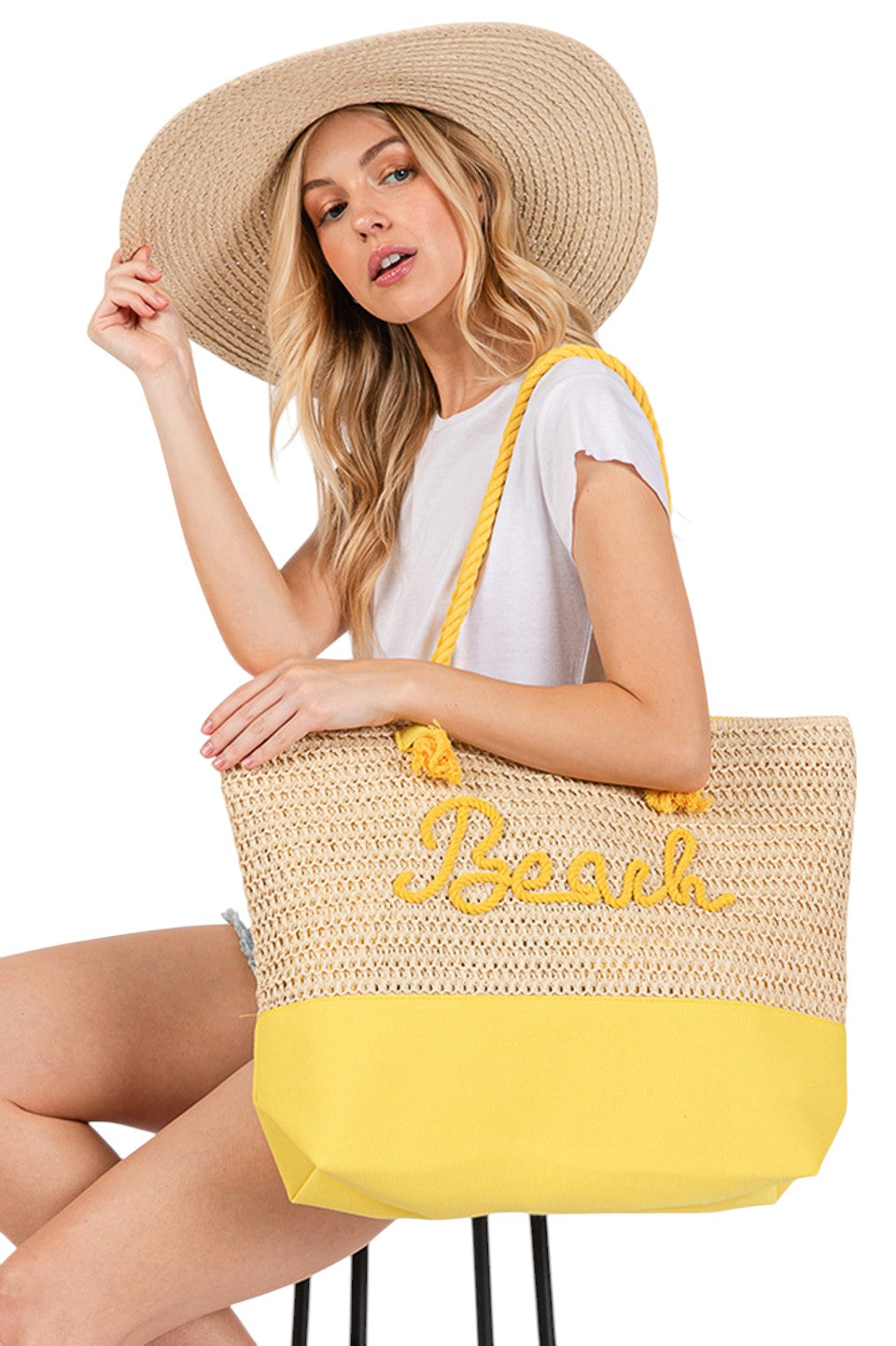 BEACH Letter Color Sewn Rope and Crochet Strap Bag combines artisanal craftsmanship with practical design. Featuring a durable rope body accented by colorful sewn lettering and a hand-crocheted strap, this bag offers both style and comfort. Its lightweight construction makes it ideal for beach outings, while the spacious interior accommodates essentials effortlessly. Perfect for those seeking a unique accessory that blends texture and vibrant detail with everyday functionality. 