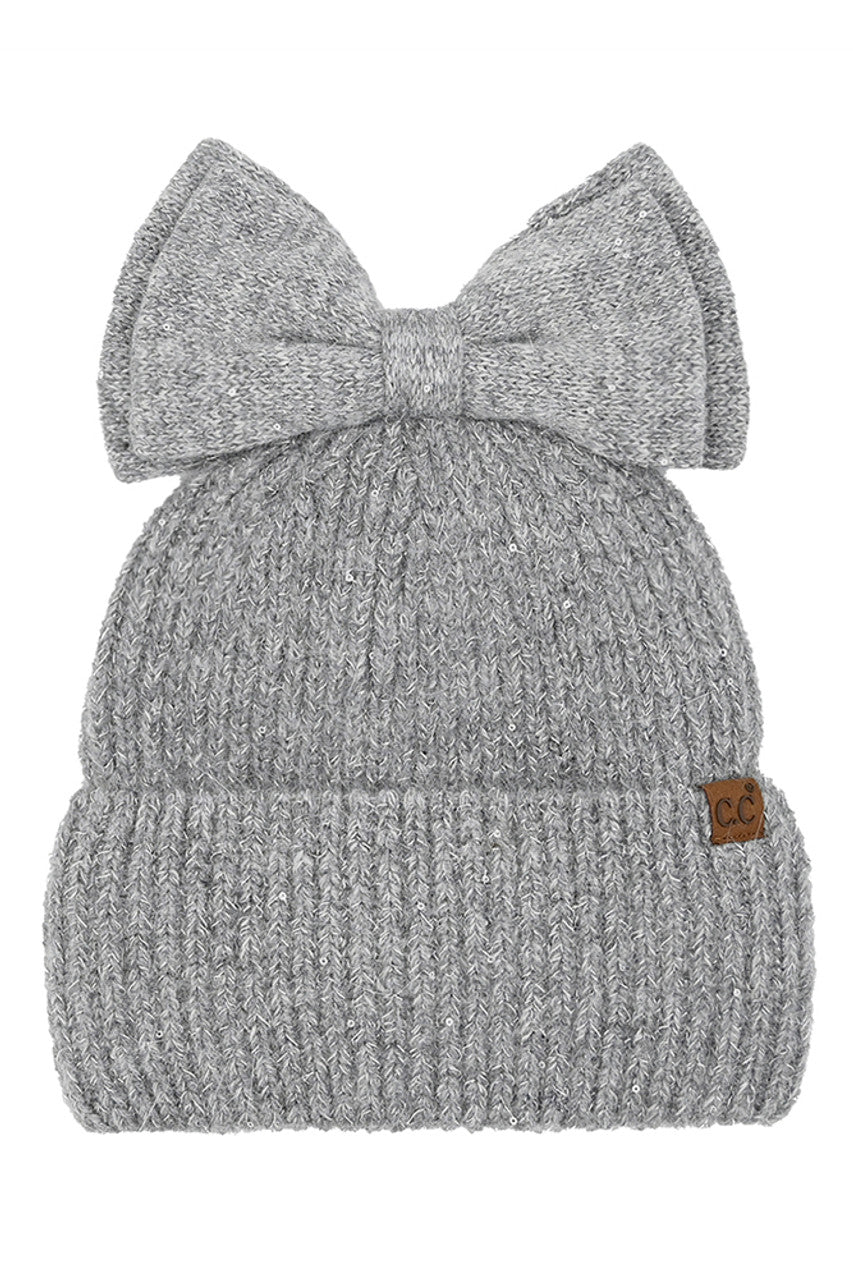 Gray C.C Messy Bun Bow Beanie with Sequins Winter Hat combines functionality with sophisticated style. The specialized opening accommodates ponytails or messy buns, while the sequin embellishments add a touch of glamour. Crafted from premium thermal materials, this winter hat delivers optimal insulation without sacrificing aesthetics. The distinctive bow detail elevates this practical cold-weather essential into a fashion statement piece.