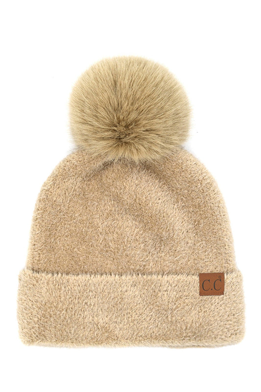 Beige C.C Plush Terry Chenille Pom Beanie Winter Hat combines superior thermal protection with refined style. Constructed from premium terry chenille fabric, this hat delivers exceptional insulation while maintaining breathability. The distinctive pom accent adds visual interest without compromising functionality. Designed with precise dimensions to ensure optimal coverage of ears and forehead, this cold-weather essential maintains its structural integrity throughout extended wear. 