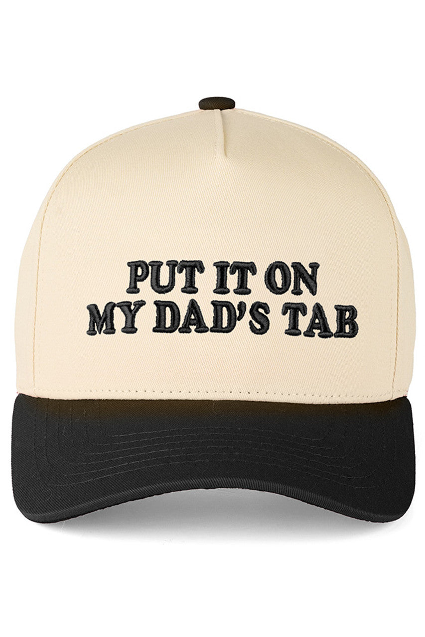 Black C.C PUT IT ON MY DAD'S TAB Letter Trucker Hat executed with high-precision embroidery technology and engineered using a composite framework featuring a stabilized front panel for enhanced rigidity and strategically placed mesh zones for superior ventilation. The calibrated snapback system offers multi-point adjustability, allowing for a tailored fit. Advanced stitching techniques at high-stress areas ensure long-term structural durability. The pre-curved brim is designed to retain its shape consistent