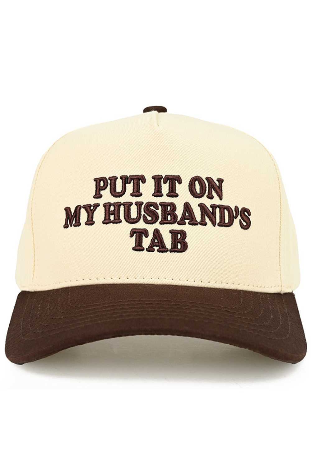 Brown C.C PUT IT ON MY HUSBAND'S TAB Letter Trucker Hat executed with multi-dimensional embroidery techniques for enhanced definition and superior wear resistance. The hat features a reinforced front panel integrated with a specialized stabilizing interface, paired with engineered mesh zones featuring optimized perforation patterns for efficient thermal regulation. Inside, an advanced moisture management system utilizes rapid-transfer technology for superior sweat control. The rear adjustment mechanism enab