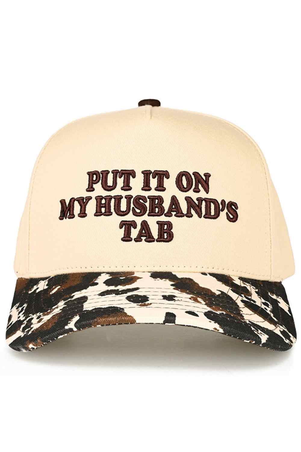 Cow C.C PUT IT ON MY HUSBAND'S TAB Letter Trucker Hat executed with multi-dimensional embroidery techniques for enhanced definition and superior wear resistance. The hat features a reinforced front panel integrated with a specialized stabilizing interface, paired with engineered mesh zones featuring optimized perforation patterns for efficient thermal regulation. Inside, an advanced moisture management system utilizes rapid-transfer technology for superior sweat control. The rear adjustment mechanism enable
