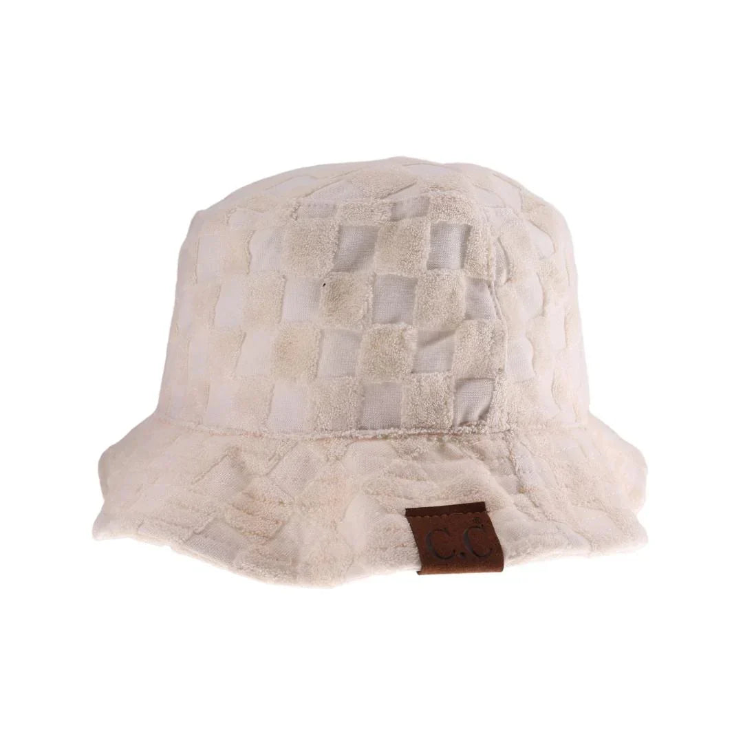 Beige Checkered Pattern Terry Cloth C.C Bucket Hat combines classic style with exceptional comfort. Crafted from soft terry cloth, this hat offers a lightweight, breathable fit ideal for all-day wear. Its distinctive checkered design adds a timeless, versatile touch, making it suitable for both casual outings and stylish ensembles. Durable and easy to care for, this bucket hat is a practical accessory that enhances your wardrobe with expert-level fashion and function. 
