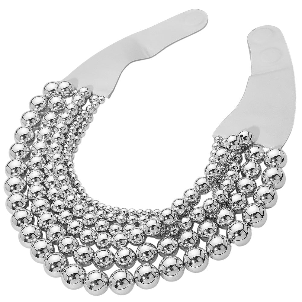 Chunky Metal Ball Beaded Multi-Layered Faux Leather Magnetic Necklace combines bold design with functional elegance. Crafted with layered faux leather strands accented by substantial metal ball beads, it delivers a textured, contemporary look. The magnetic clasp provides secure, easy fastening, enhancing wearability without compromising style. Ideal for professionals seeking a statement accessory that balances durability and modern sophistication. 