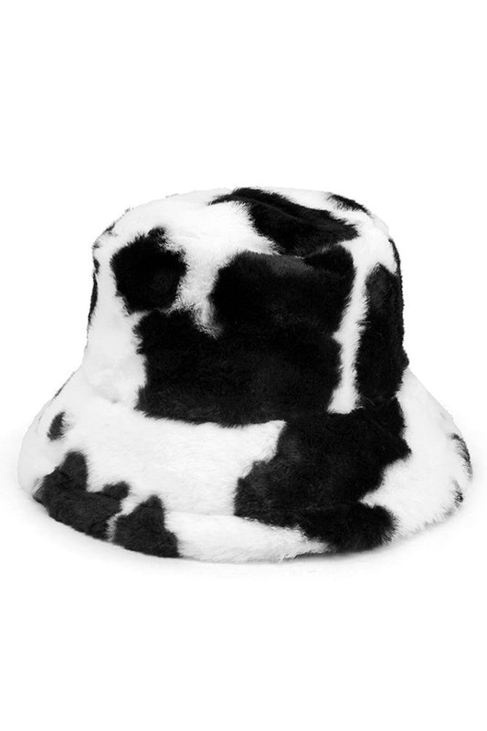 Black Cow Print Faux Fur Bucket Hat combines distinctive black and white patterning with premium textural elements for a fashion-forward statement piece. The meticulously constructed faux fur provides superior insulation while maintaining ethical standards. Its structured silhouette offers versatile styling options across seasons, making it an essential accessory for the discerning fashion enthusiast seeking both functionality and avant-garde design. 