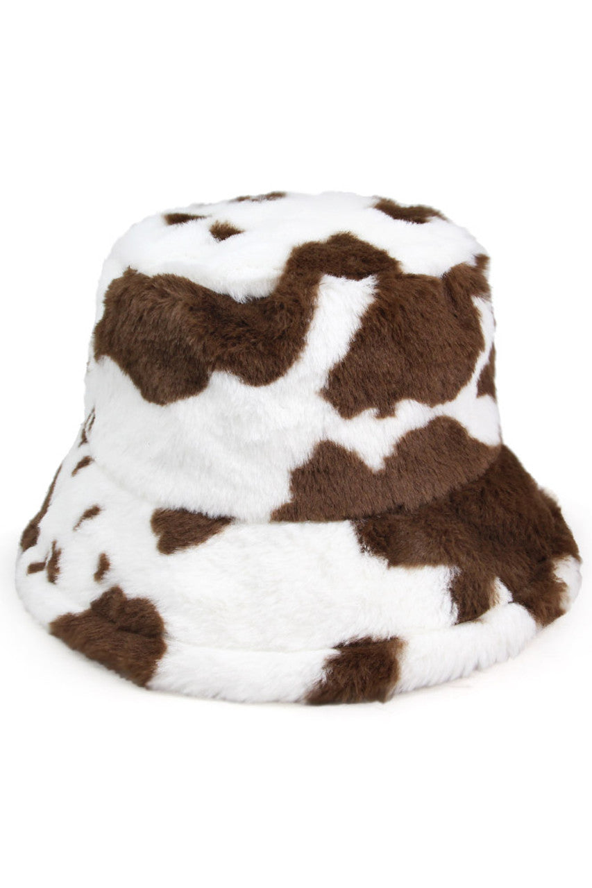 Brown Cow Print Faux Fur Bucket Hat combines distinctive black and white patterning with premium textural elements for a fashion-forward statement piece. The meticulously constructed faux fur provides superior insulation while maintaining ethical standards. Its structured silhouette offers versatile styling options across seasons, making it an essential accessory for the discerning fashion enthusiast seeking both functionality and avant-garde design. 