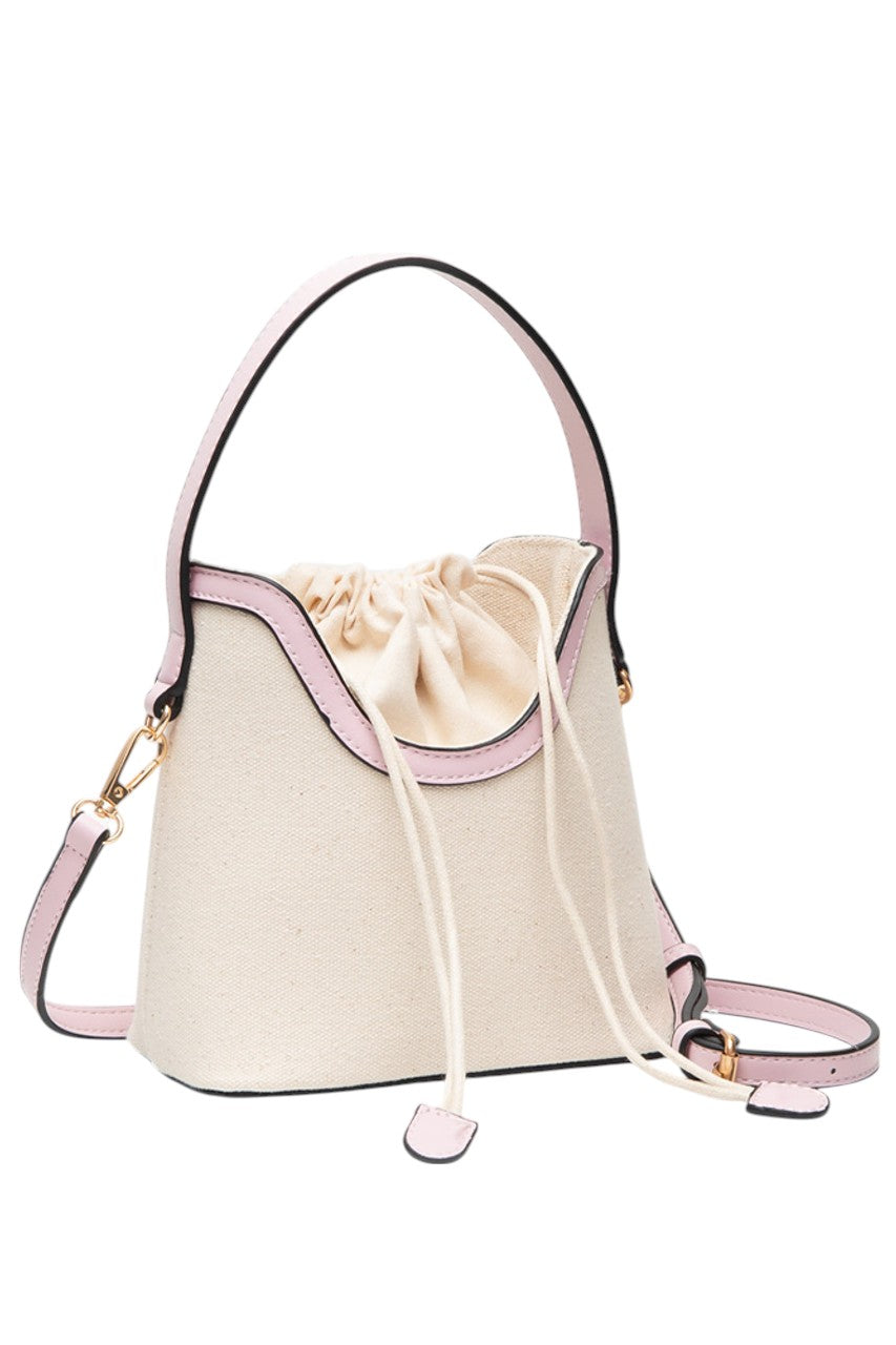 LightPink Drawstring Satchel Canvas Crossbody Bucket Bag combines durable canvas material with a practical bucket design, secured by a convenient drawstring closure. Its adjustable crossbody strap offers hands-free comfort, making it ideal for daily use or travel. This bag provides ample space for essentials while maintaining a compact, stylish profile suitable for various occasions. 