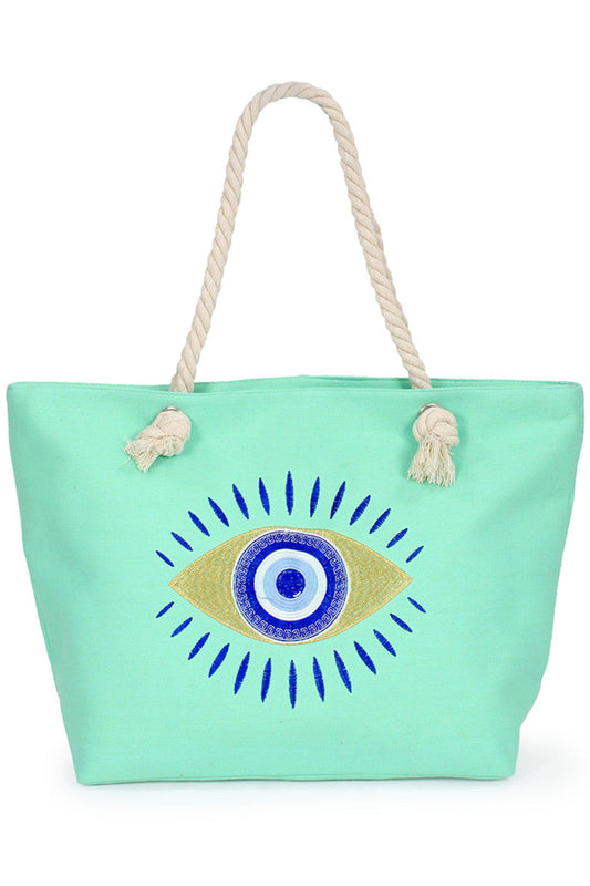Mint Evil Eye Beach Tote Bag combines style and practicality for your seaside adventures. Crafted with durable materials, it offers ample space to carry essentials like towels, sunscreen, and snacks. Its distinctive evil eye design not only adds a unique aesthetic but also symbolizes protection, making it a thoughtful accessory for beachgoers. Lightweight and easy to clean, this tote ensures convenience without compromising on fashion. Perfect for those who value both function and meaningful design in their