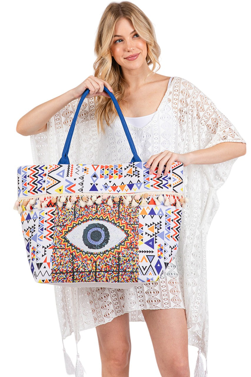 Multi Evil Eye Boho Print Pom Pom Tassel Summer Tote Bag combines vibrant bohemian style with practical design. Crafted for summer outings, it features a striking evil eye print that adds a protective and trendy touch. The playful pom pom tassels enhance its unique aesthetic, while the spacious interior offers ample room for essentials. Durable and lightweight, this tote is ideal for beach days, casual errands, or festivals, providing both fashion and function in one versatile accessory. 