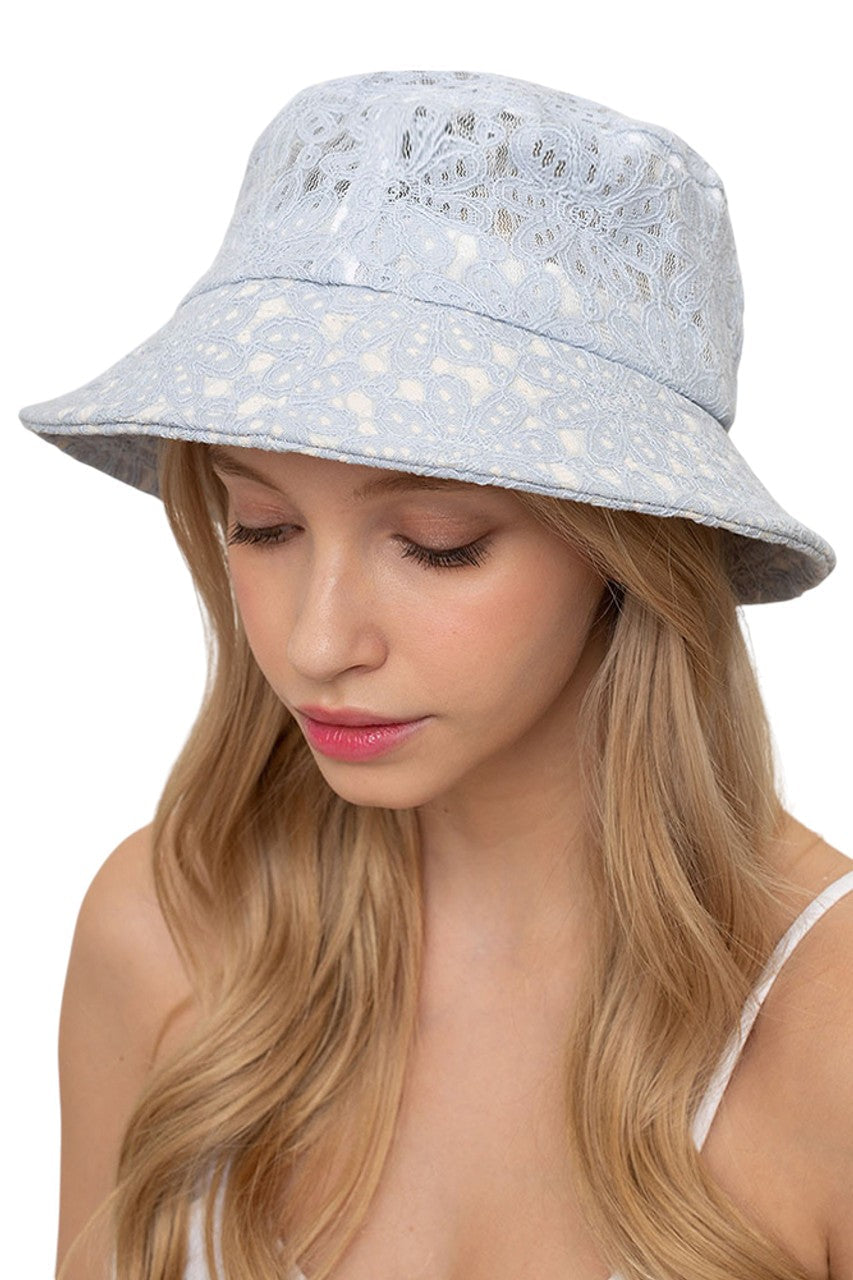 Blue FLORAL LACE BUCKET HAT combines a timeless silhouette with intricate lace patterning for a sophisticated accessory. The breathable construction offers optimal comfort while providing effective sun protection. Precision-crafted with durable materials, this versatile piece transitions seamlessly between casual and formal settings. The dimensional floral detailing adds texture and visual interest to any ensemble.