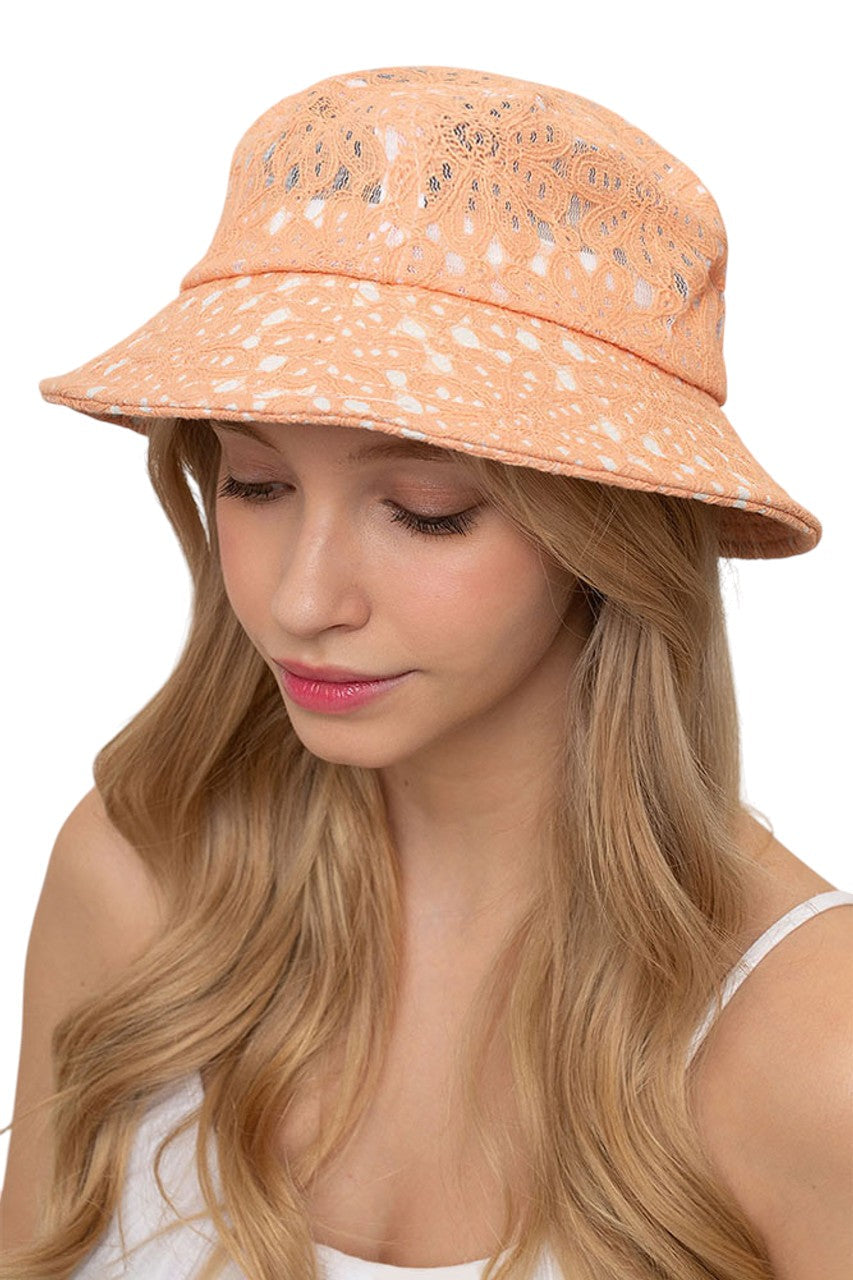 Peach FLORAL LACE BUCKET HAT combines a timeless silhouette with intricate lace patterning for a sophisticated accessory. The breathable construction offers optimal comfort while providing effective sun protection. Precision-crafted with durable materials, this versatile piece transitions seamlessly between casual and formal settings. The dimensional floral detailing adds texture and visual interest to any ensemble.
