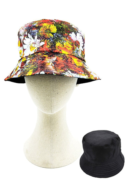 Multi Floral Reversible Bucket Hat features a vibrant floral pattern on one side and a complementary solid color on the reverse, offering versatile styling options. Constructed with premium materials for durability and comfort, it provides effective sun protection while elevating your seasonal wardrobe with its thoughtful design and practical functionality.