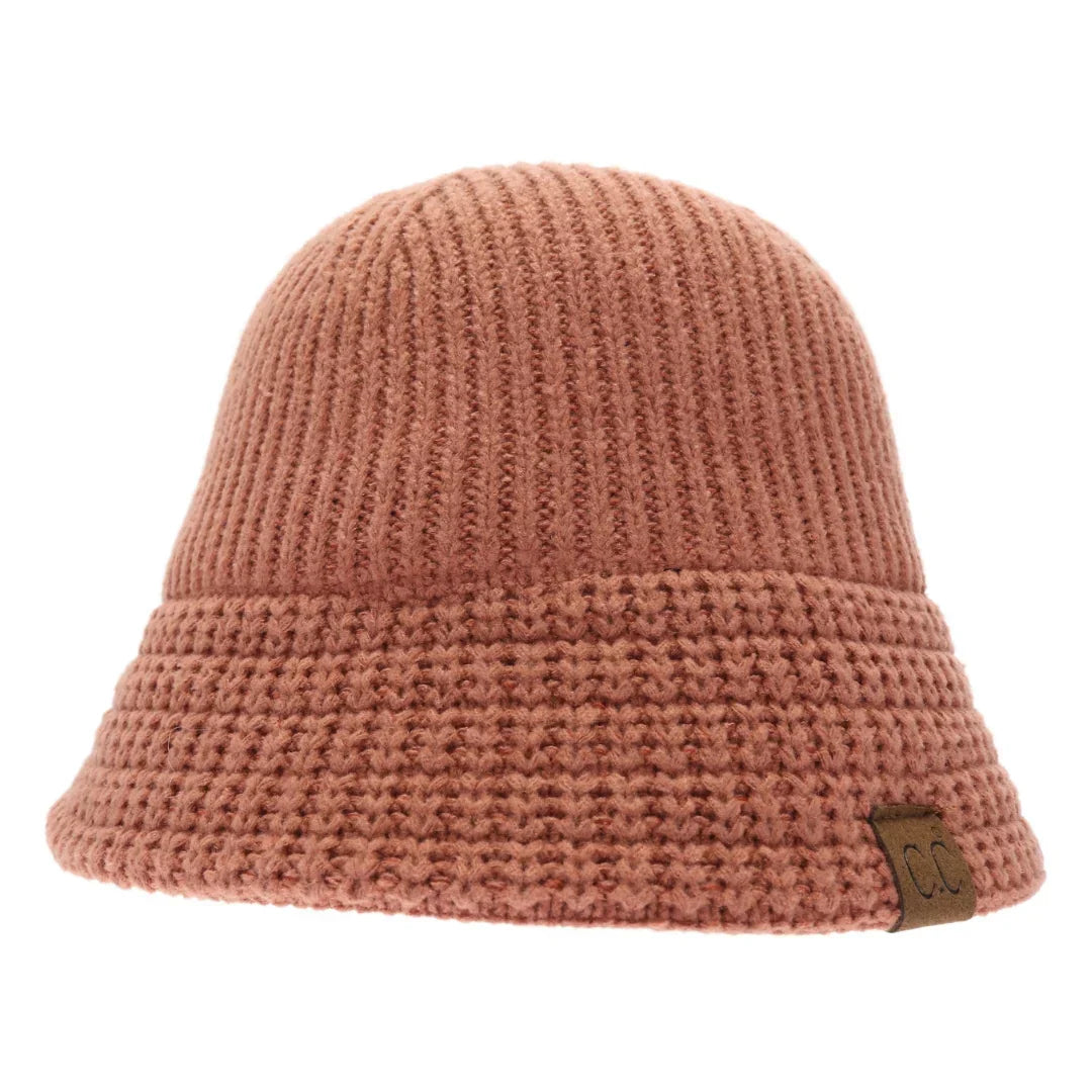 Brick Knitted Cloche C.C Bucket Hat combines classic cloche styling with the casual appeal of a bucket hat, crafted from soft, durable knit fabric. Its structured yet flexible design offers comfortable wear and a flattering fit, making it an ideal accessory for cooler seasons. This hat offers both warmth and style, making it perfect for adding a sophisticated edge to everyday outfits. 