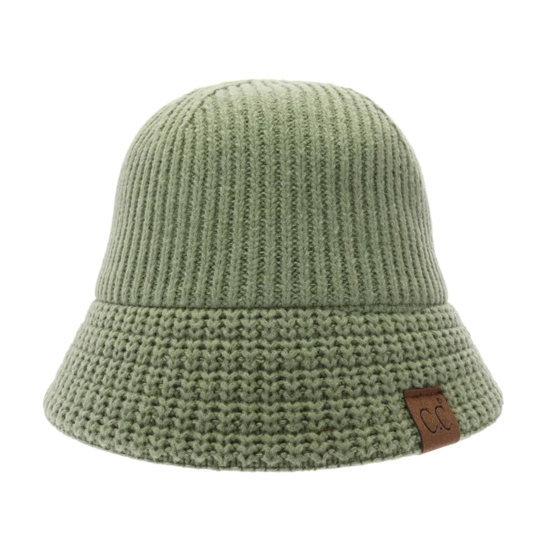 Dark grass Knitted Cloche C.C Bucket Hat combines classic cloche styling with the casual appeal of a bucket hat, crafted from soft, durable knit fabric. Its structured yet flexible design offers comfortable wear and a flattering fit, making it an ideal accessory for cooler seasons. This hat offers both warmth and style, making it perfect for adding a sophisticated edge to everyday outfits. 
