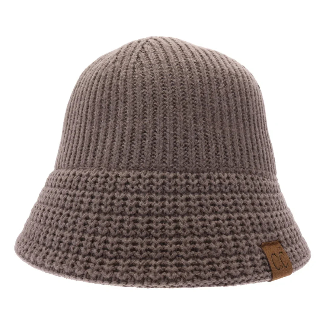 EarthGrey Knitted Cloche C.C Bucket Hat combines classic cloche styling with the casual appeal of a bucket hat, crafted from soft, durable knit fabric. Its structured yet flexible design offers comfortable wear and a flattering fit, making it an ideal accessory for cooler seasons. This hat offers both warmth and style, making it perfect for adding a sophisticated edge to everyday outfits. 
