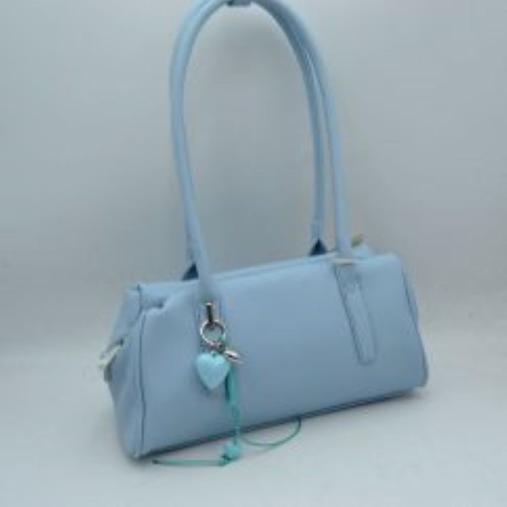 Light-blue Bring timeless sophistication to your wardrobe with this sleek, east-west structured shoulder bag. Designed with a clean silhouette, this bag features an extended rectangular body with subtle, textured grain details that offer a refined look. The dual tall shoulder straps are engineered to sit comfortably over the arm, making it an ideal option for effortless daily carrying. Adding a touch of playful elegance, a polished metallic ring hangs from the front handle base, featuring a charming layered