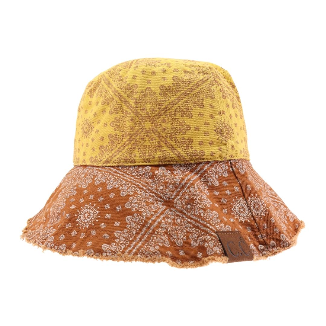 Mustard Multi Color Paisley Bandana C.C Bucket Hat combines classic paisley patterns with vibrant colors for a stylish, versatile accessory. Crafted for comfort and durability, this bucket hat offers sun protection while enhancing your outfit with a timeless design. Perfect for outdoor activities or casual wear, it balances fashion and function effortlessly. 