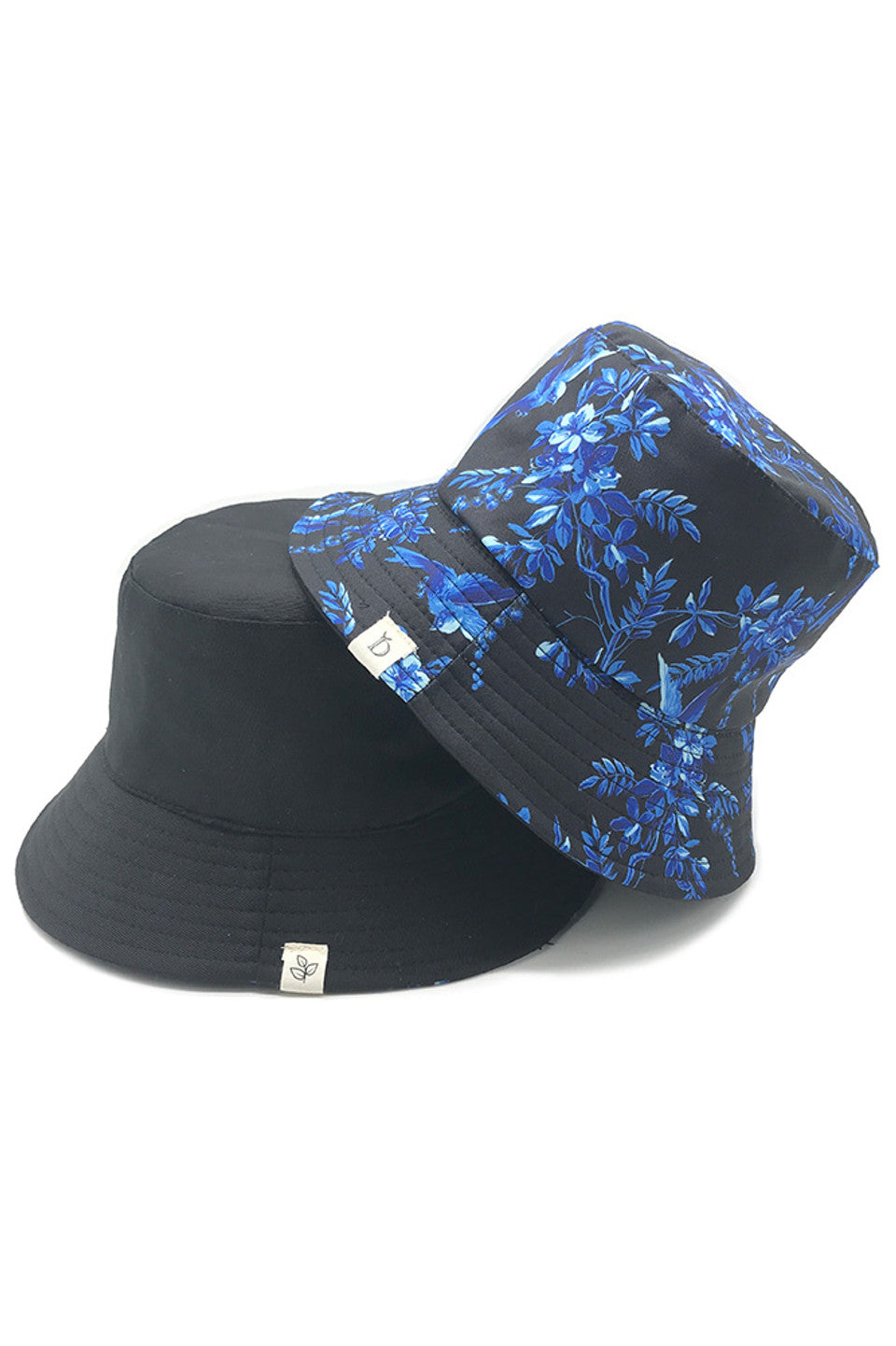 Black ORIENTAL FLORAL BUCKET HAT features an authentic Oriental floral design, expertly rendered on premium fabric. The precision-crafted pattern draws inspiration from classical Eastern artistic traditions, while the structured silhouette offers reliable sun protection with a distinguished style. Its balanced proportions ensure a comfortable fit, making this a technically superior accessory that seamlessly integrates cultural artistry with practical functionality.