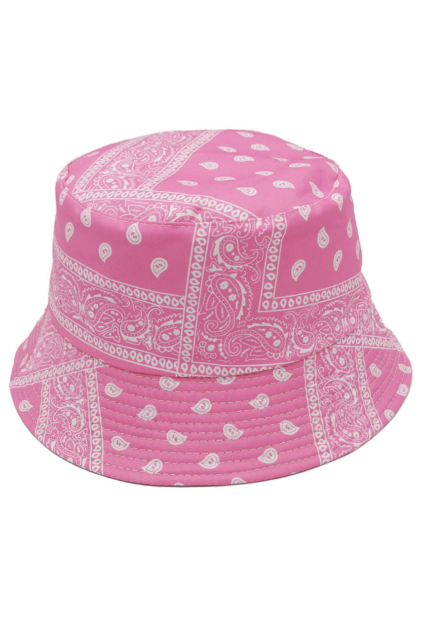 Pink PAISLEY REVERSIBLE BUCKET HAT offers dual-wearing options with its distinctive paisley pattern on one side and a complementary solid reverse. Constructed with premium materials for superior shape retention and comfort. The versatile silhouette provides excellent sun protection while delivering a sophisticated aesthetic that transitions seamlessly between casual and refined settings. 