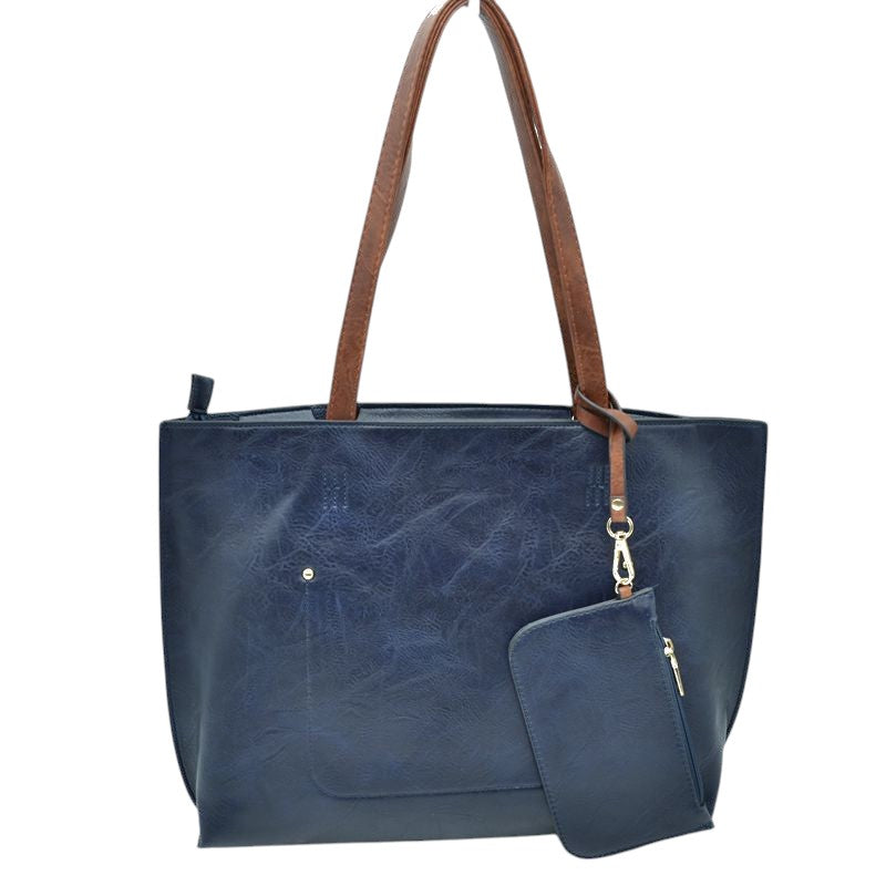 The Soft PU Vegan Leather 2 in-1 Tote Crossbody Handbag with Detachable Wristlet Coin Purse, Best Seller Tote, Handbag has plenty of room to fit all your items, available in a few colours. Handbag also comes with a removable insert bag that doubles as lining to the bag or can be removed and worn as a crossbody bag. This 2 in 1 tote bag is just what the boss lady needs